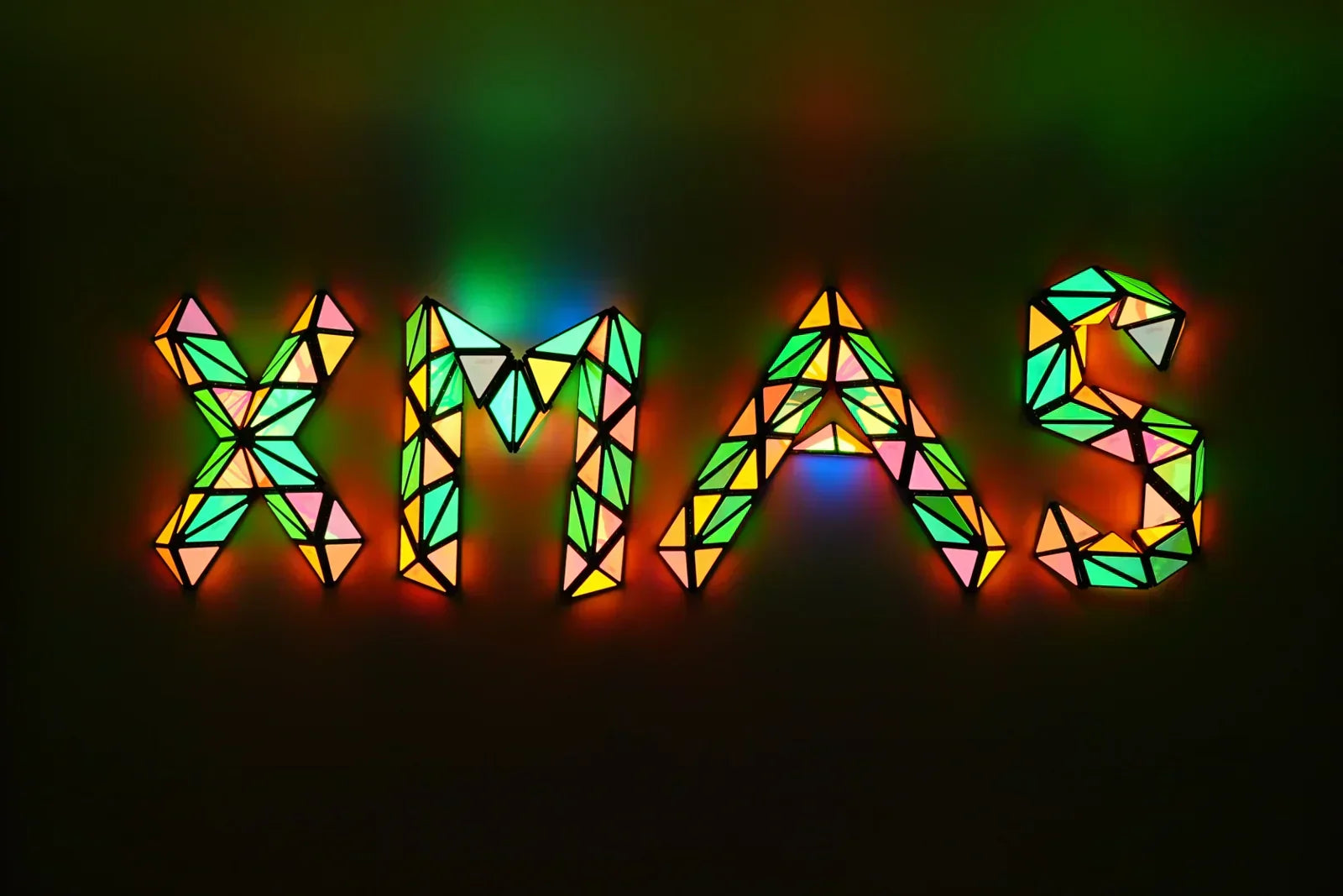 TOSY Magnetic Pyramid Glow set arranged as “XMAS”, glowing magnetic blocks creating a festive Christmas word design